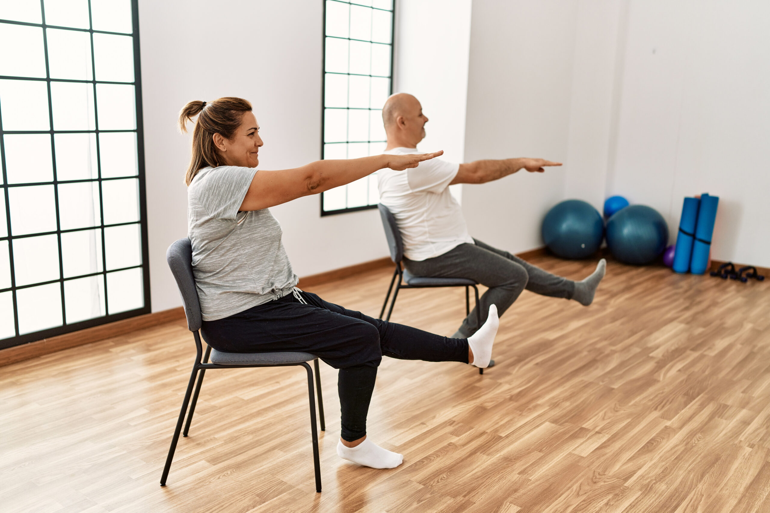 Personal Training Older Population and Seniors using Chair exercises to workout in private personal training studio